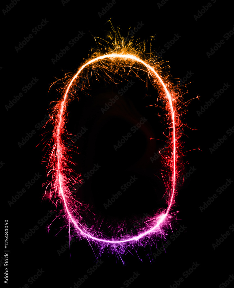0.Digit zero made of firework sparklers at night