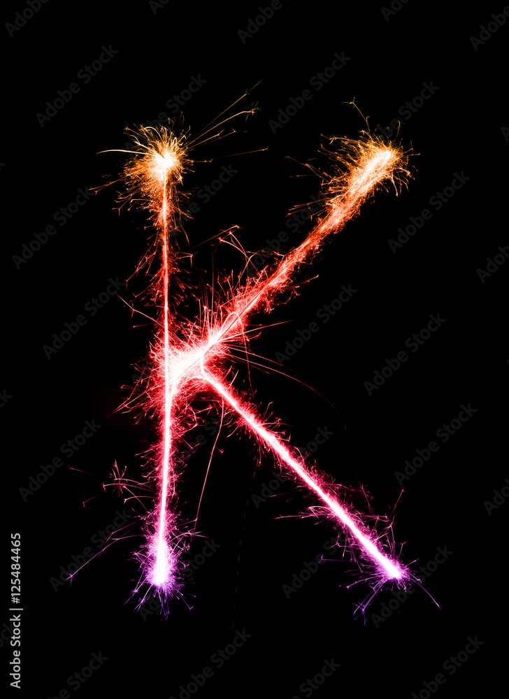 Sparkler firework light alphabet K (Capital Letters) at night Sparkler firework light alphabet K (Capital Letters) at night