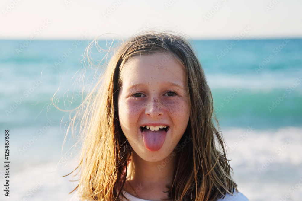 portrait of a real 10 years old girl walking on the beach portrait of a real 10 years old girl walking on the beach