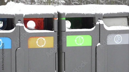 Small bins for rubbish and trash, recycling in winter park. Zoom out. 4K photo