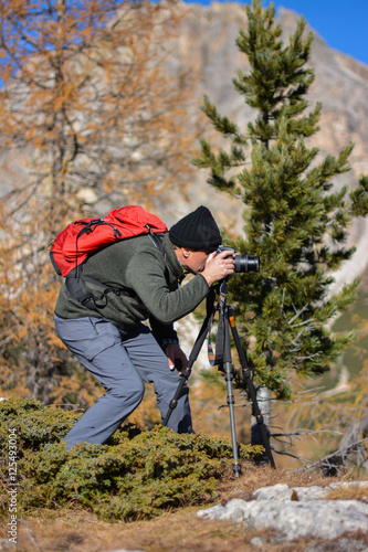man photographing the mountains