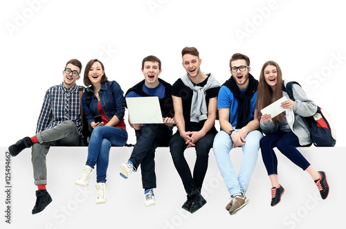 Causal group of people sitting on the floor isolated