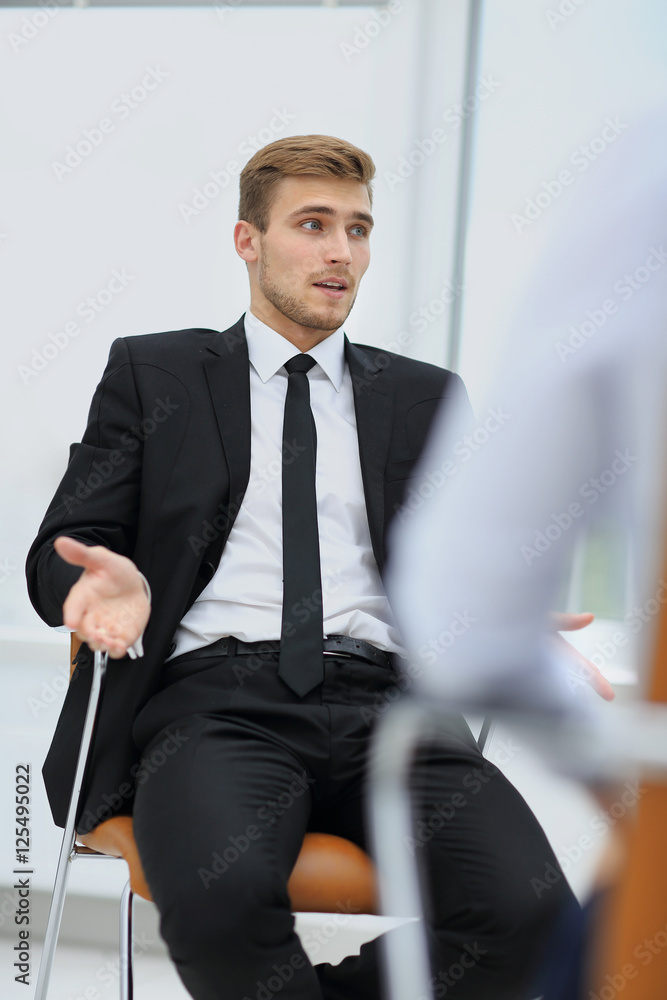 Handsome smiling businessman talking Handsome smiling businessman talking