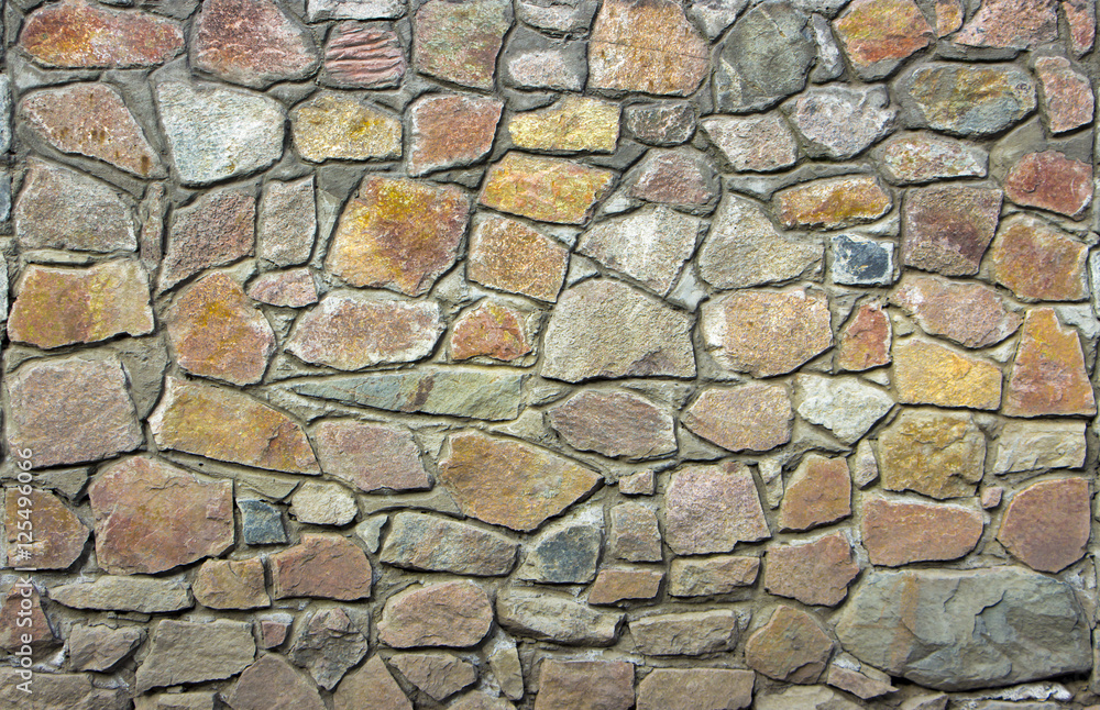wall of granite boulders of different colors wall of granite boulders of different colors