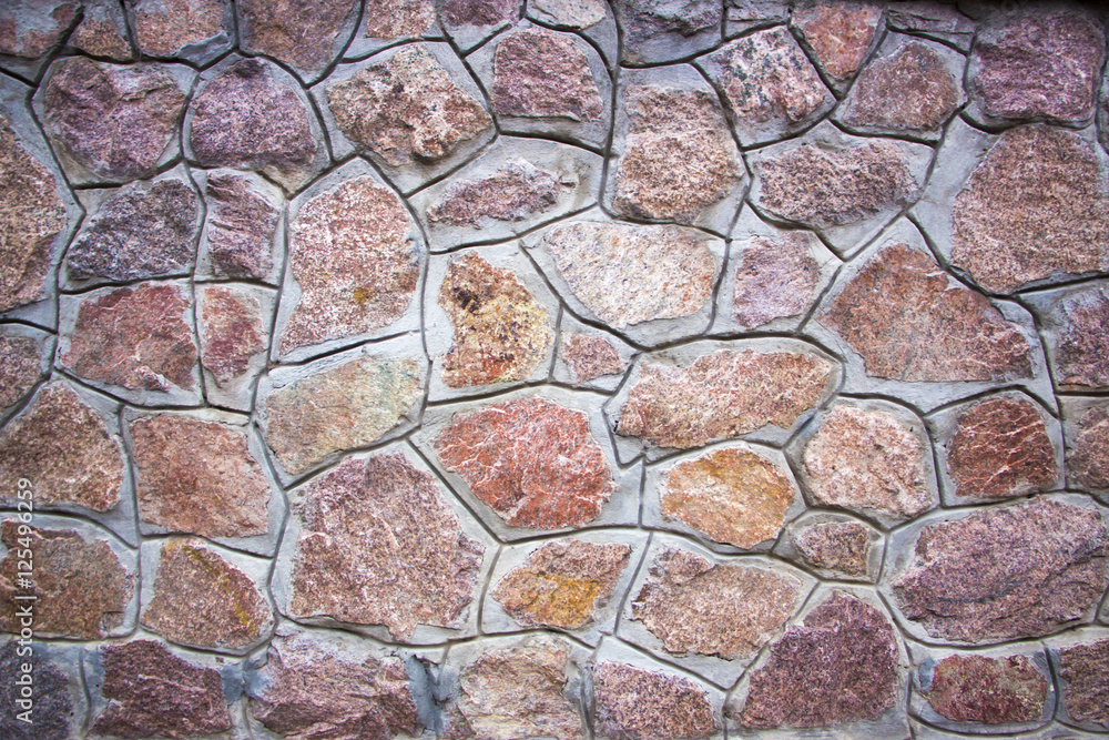 Traditional Stone Brick Wall made of fragment stones Traditional Stone Brick Wall made of fragment stones