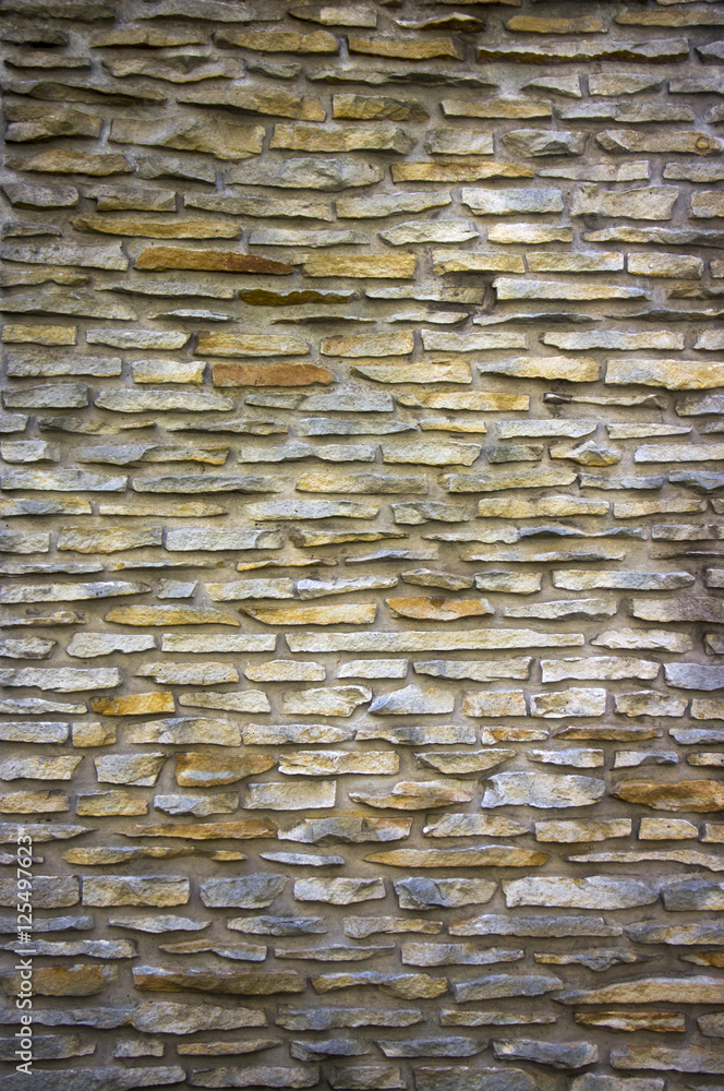 Fototapeta premium parti-coloured slate wall texture and background