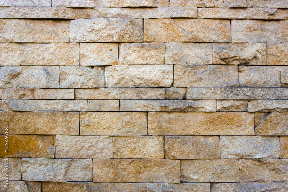 Fototapeta premium house wall decorated with multi-colored sandstone wall tiles