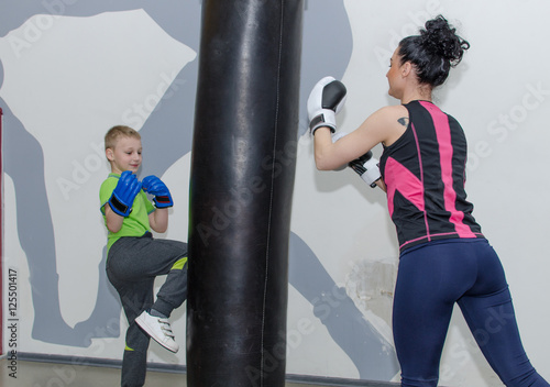 Mother and son training boxing