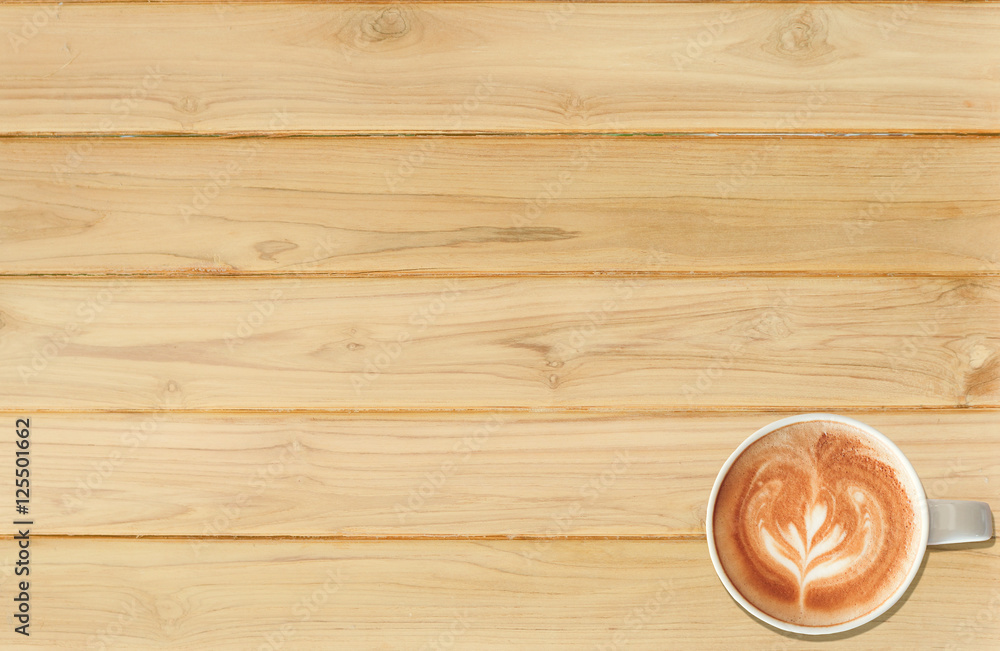Coffee cup top view on teak wood texture background. Coffee cup top view on teak wood texture background.