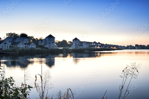 Stunning dawn landscape image of clear sky over calm lake
