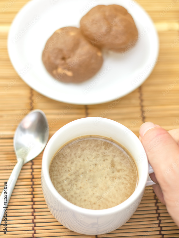 hot coffee and chocolate cookies on bamboo plate, vintage tone effect hot coffee and chocolate cookies on bamboo plate, vintage tone effect