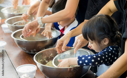 Asian children are cooking ice cream in cooking class photo