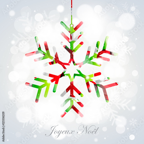 Flocon rouge et vert suspendu sur bokeh