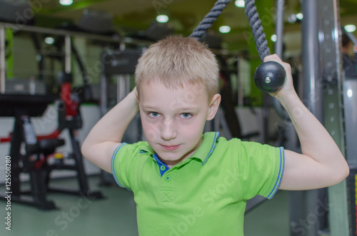 boy is training in the gym photo