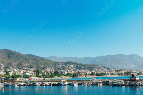 The port with ships near the shore of Antalya