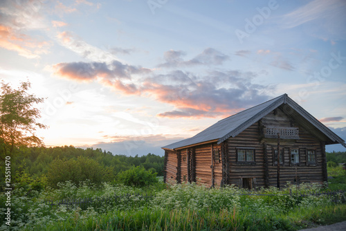 old log farmhouse in the beautiful sky