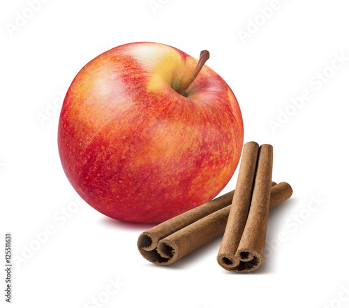 Whole red apple and cinnamon sticks isolated on white