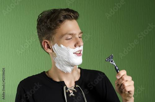фотографія Teen in puberty starting to shave