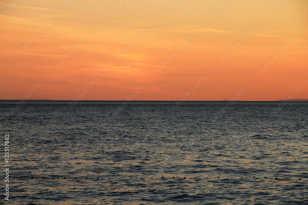 Sunset over the Adriatic sea in Brela , Croatia