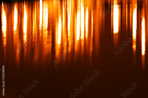 Vertical orange water reflections background