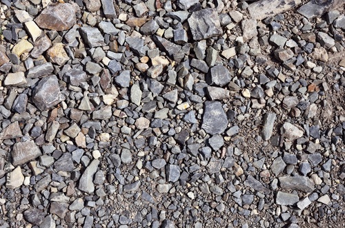 The texture of a rocky dirt road. Mountain road.