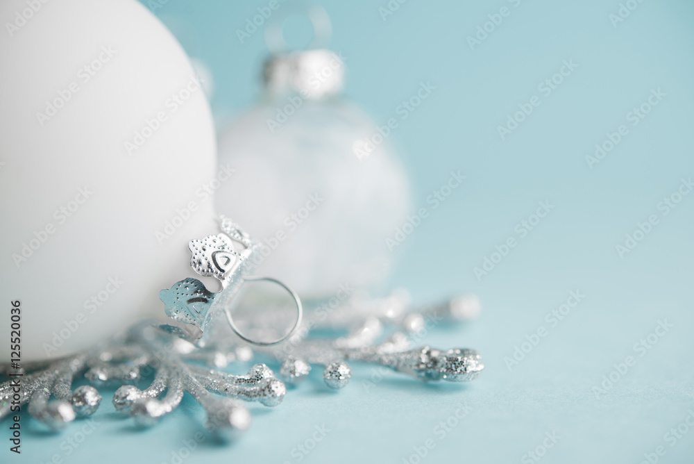 White xmas ornaments on light blue background. Merry christmas card. Winter holidays. Xmas theme. Space for text. Happy New Year. White xmas ornaments on light blue background. Merry christmas card. Winter holidays. Xmas theme. Space for text. Happy New Year.