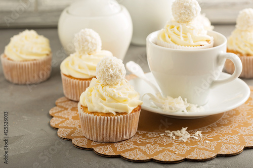 Coconut cupcakes with white frosting
