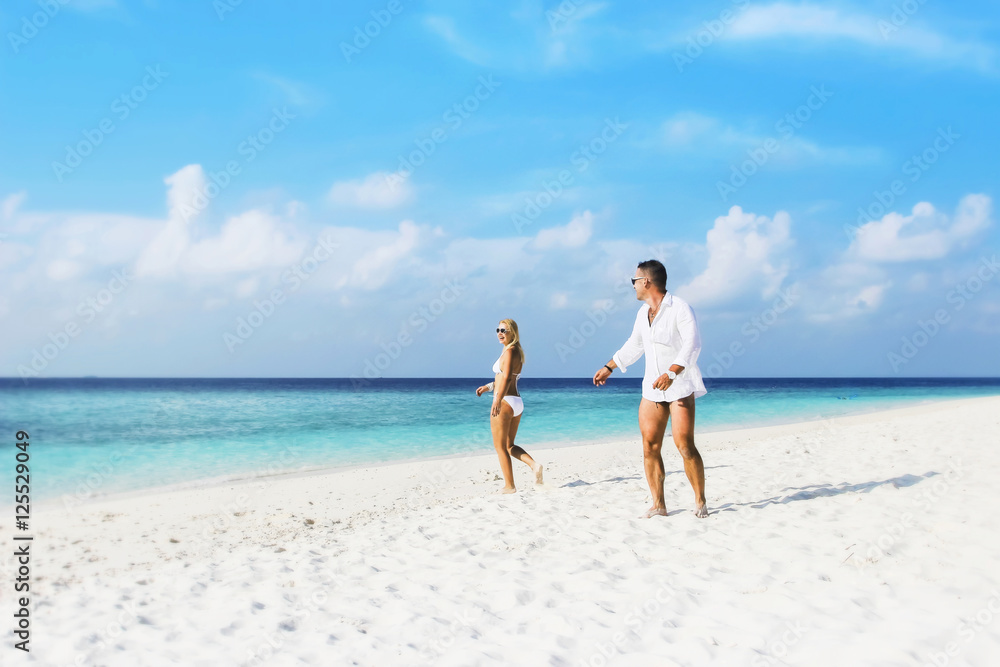 Couple in love on the beach. Wedding in the Maldives.