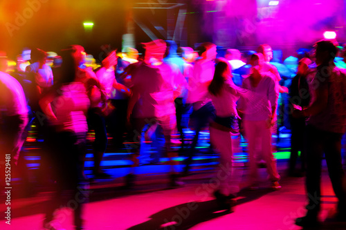 people relax and dance in a disco