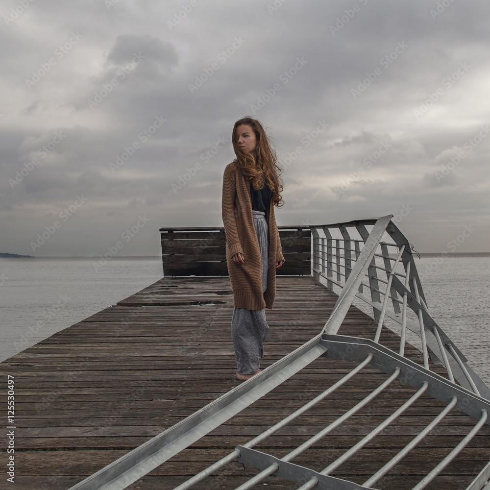 Girl at the old ruin berth at sea Girl at the old ruin berth at sea