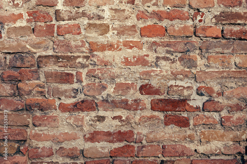 Red old brick wall structure background.