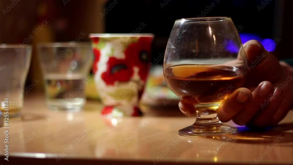 Ukranian Man Drinks Alcohol And Puts it on The Table in Ukraine in Marioupol Ukranian Man Drinks Alcohol And Puts it on The Table in Ukraine in Marioupol