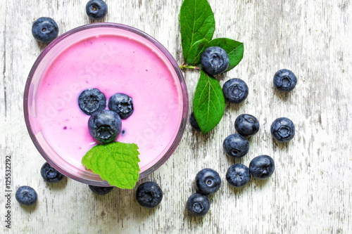homemade fresh fruit smoothie or yogurt with blueberries and fre