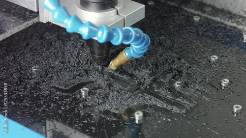 close up shot of a small cnc router machine milling plastic parts