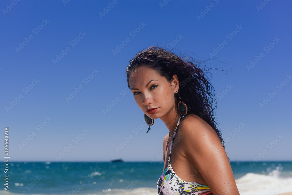 Beautiful woman in bikini on the sunny beach outdoors background Beautiful woman in bikini on the sunny beach outdoors background