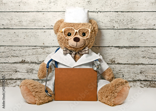 Teddy bear-doctor with a book