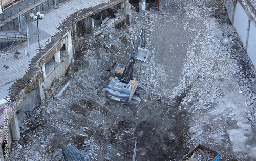 An excavator tear down the fameous area Slussen in central Stock photo