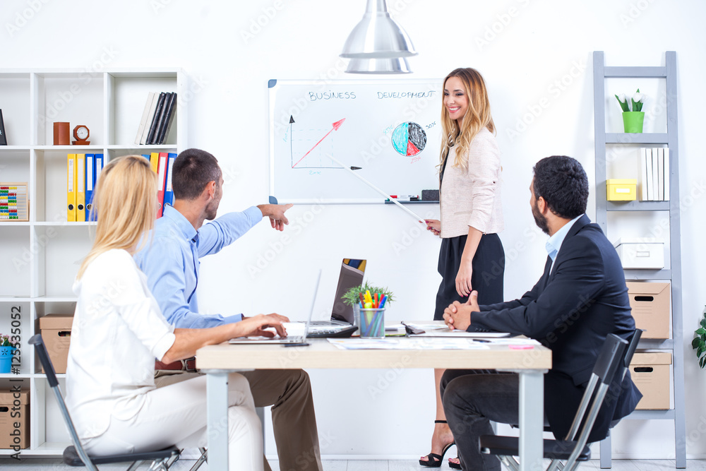 Group Of Business People Having Meeting In Office. Business partners discussing documents and ideas at meeting Group Of Business People Having Meeting In Office. Business partners discussing documents and ideas at meeting