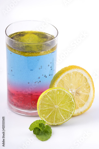Colorful drink with fruit decoration.