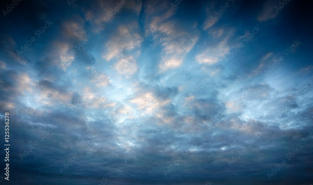 Obraz premium blue sky feather clouds, sunset with reflection on clouds, HDR 