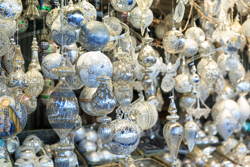 Colorful close up details of christmas fair market. Balls decora