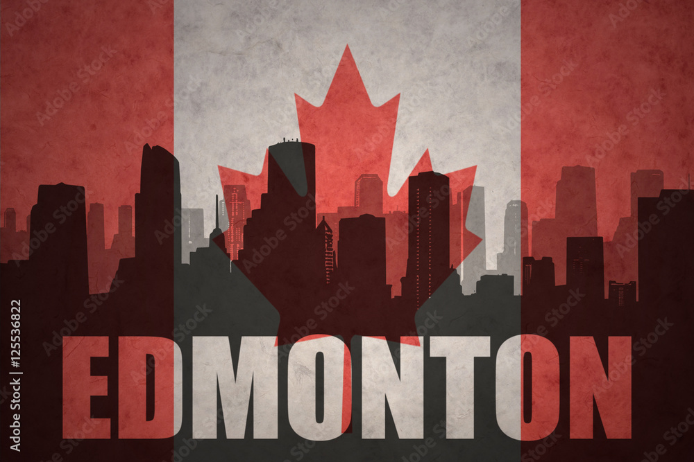 abstract silhouette of the city with text Edmonton at the vintage canadian flag