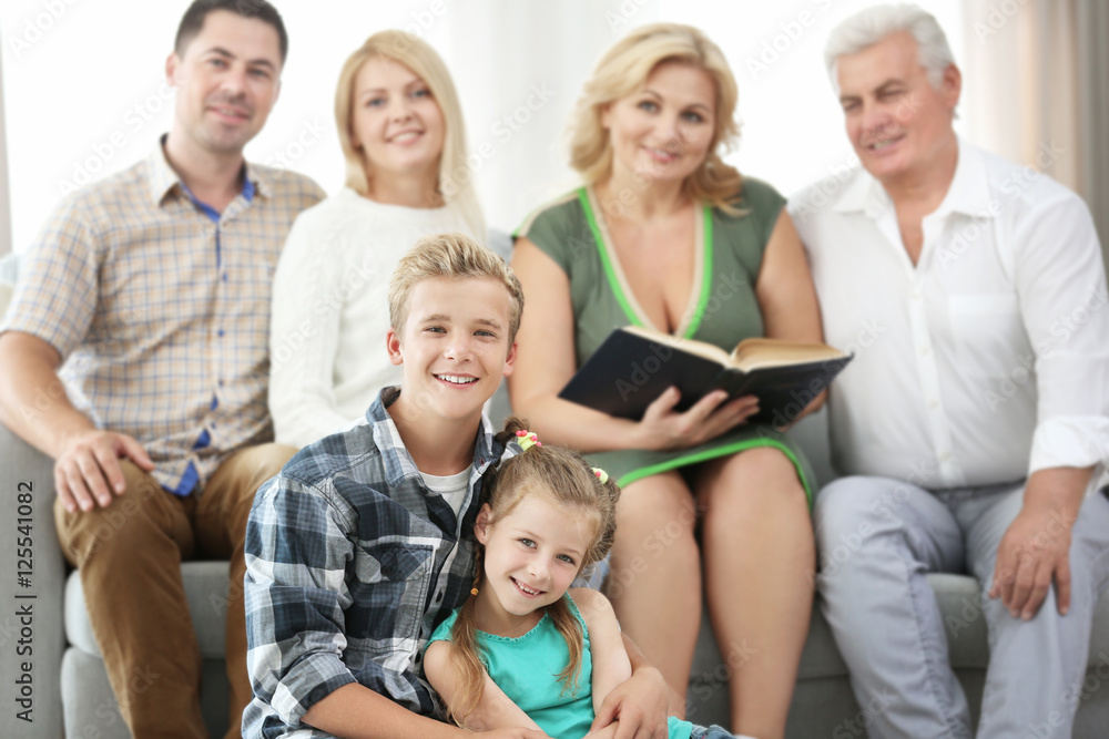 Happy family reading book at home Happy family reading book at home