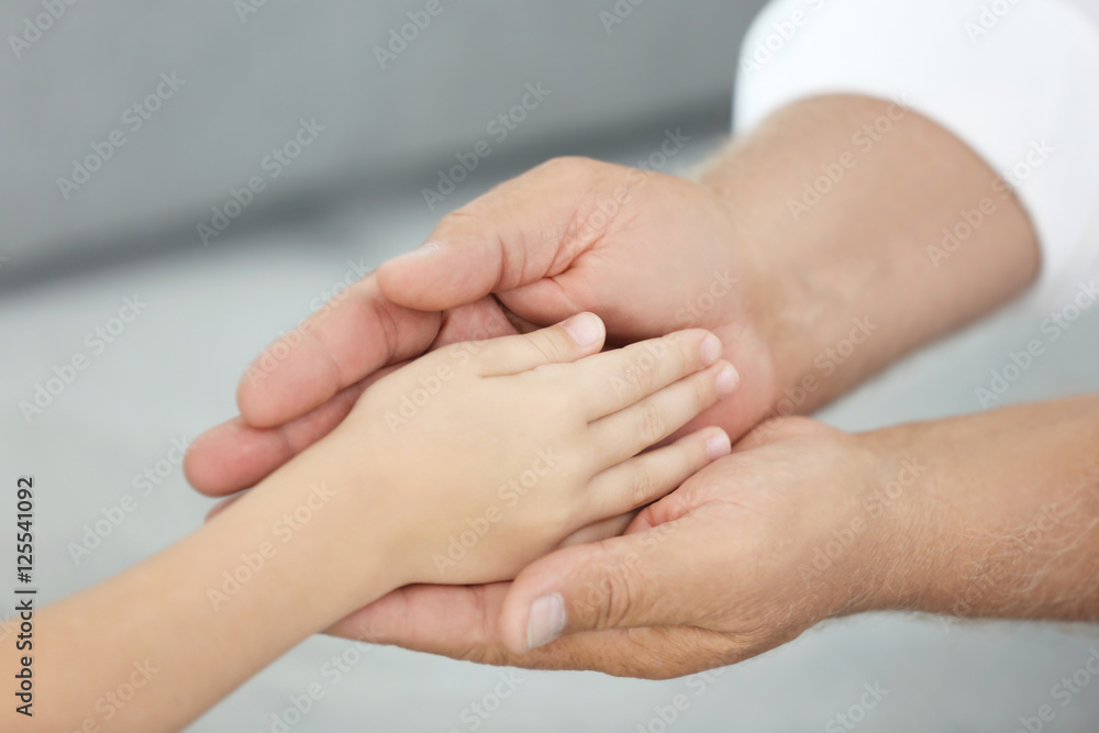 Old and young hands, closeup Old and young hands, closeup