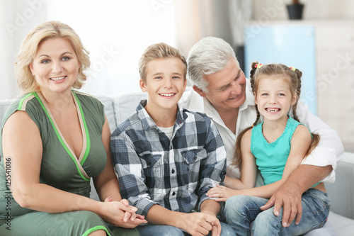 Grandparents with grandchildren on couch