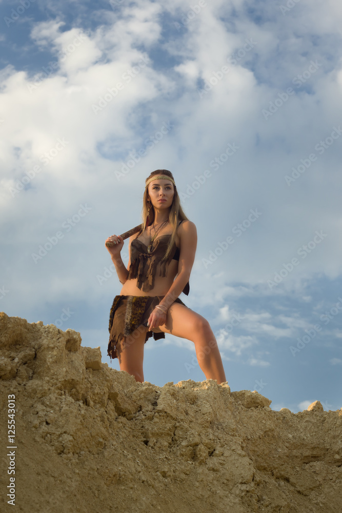 Prehistoric woman with the stone axe hunting Prehistoric woman with the stone axe hunting