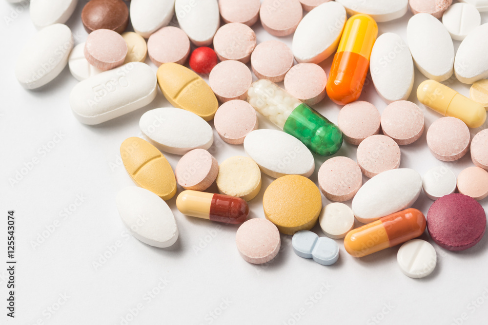 Multiple pills depicting medical treatment or pahrmaceutical ind Multiple pills depicting medical treatment or pahrmaceutical ind