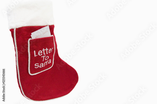 Christmas stocking with a letter to Santa in the front pocket