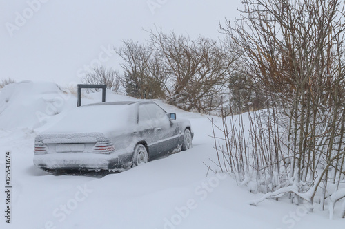 Old classic car frozen in an hard winter in Sweden/Scandinavia