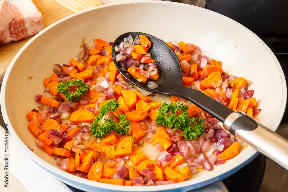 Cut the onions and carrots cooking in a pan
